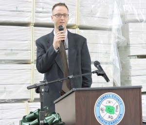 Woodgrain Millwork’s Vice President Greg Easton speaks at a ribbon-cutting ceremony at the company’s new manufacturing facility in Lenoir. Photo: the Caldwell County Economic Development Commission