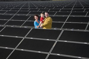 The Suneson family posing at SMUD’s first Solar Shares program 1 MW solar array, Nilsen turkey farm in Wilton, California. Photo: Source: SMUD’s photo library, Gordon Lazeroni, photographer
