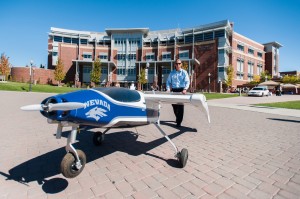 Kyle Pruett, a UNR graduate, is pictured with Drone America’s Phoebus MK.III at the 4-H National Science Event day held at the university last October.  Photo courtesy: Nevada Advanced Autonomous Systems Innovation Center